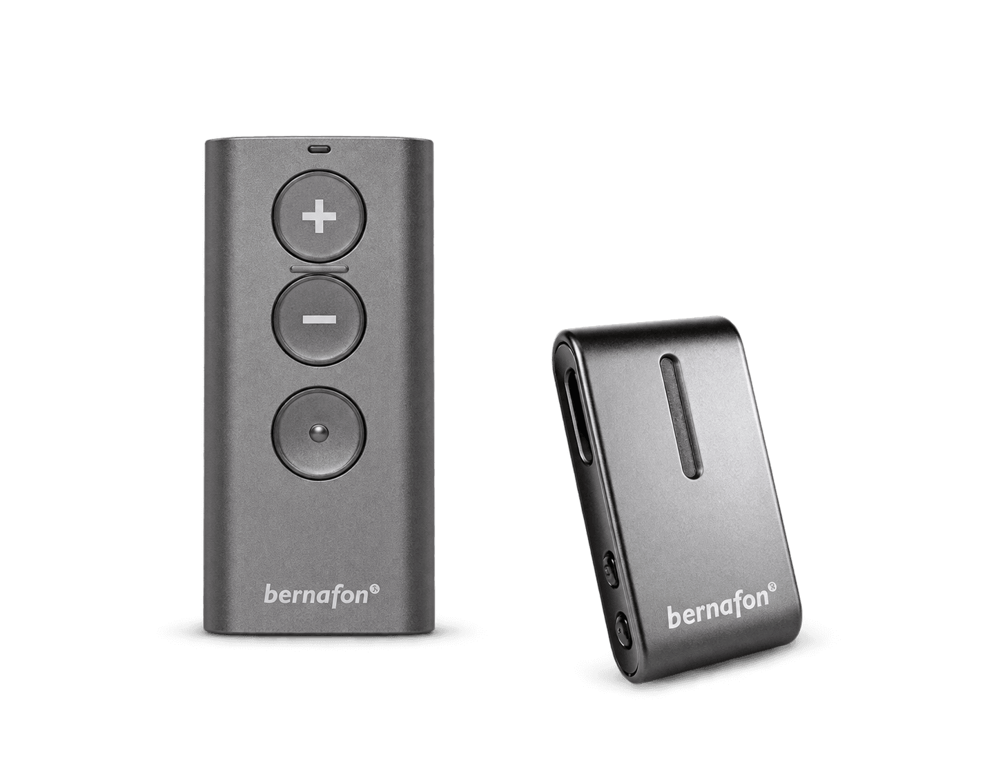 A grey Bernafon RC-A remote control beside a SoundClip-A microphone