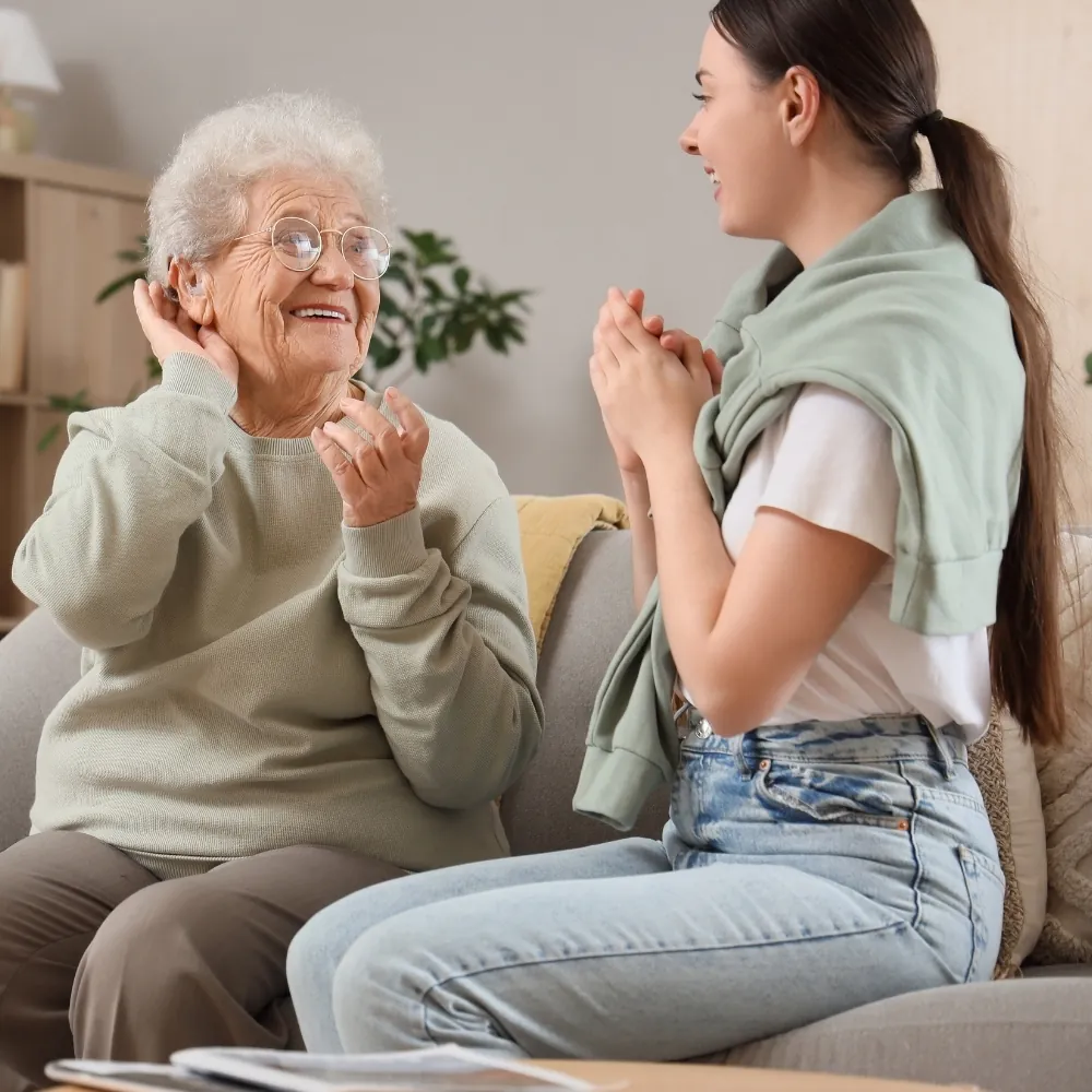 Audiologist carrying out a home hearing test appointment